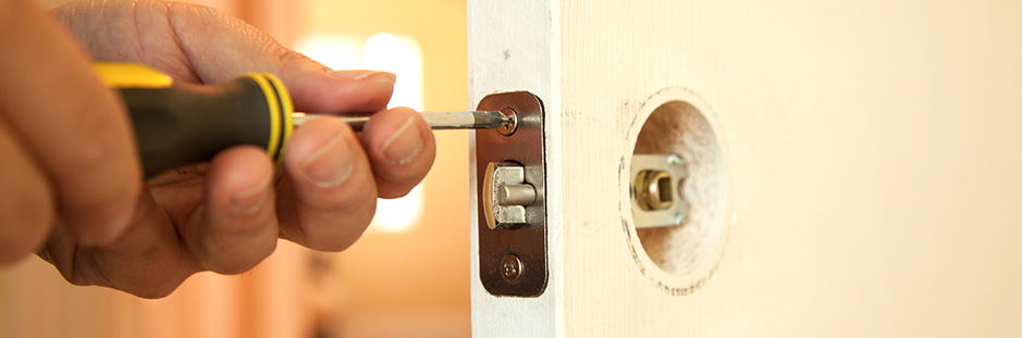 Handyman working on door